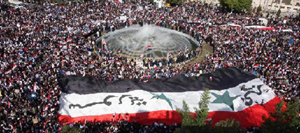 Hàng triệu người biểu tình khắp Syria phản đối quyết định của Liên đoàn Arập đình chỉ quy chế thành viên của Syria.
