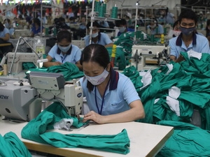 Dệt may là mặt hàng xuất khẩu chủ lực của Việt Nam sang Mỹ. (Ảnh minh họa: Thanh Vũ/TTXVN).